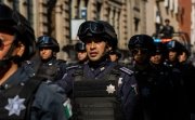 Puebla, Mexico - September 16, 2022: Puebla state police officers walk the streets in a surveillance operation