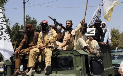 Taliban fighters celebrate the third anniversary of the withdrawal of US-led troops from Afghanistan, in Kabul, Afghanistan, Wednesday, Aug. 14, 2024. (AP Photo/Siddiqullah Alizai)