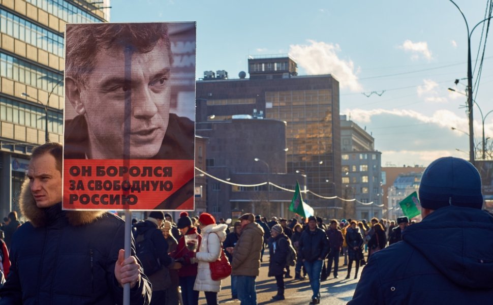 Moscow - February 27, 2016. Memory march of slain politician Boris Nemtsov. Demonstrator with a banner "He fought for free Russia" and portrait of Boris Nemtsov