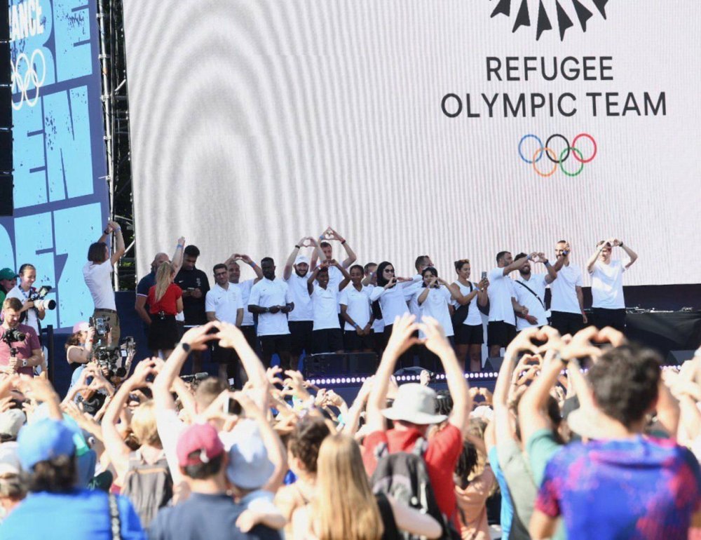 Refugee Olympic Team 2024 on Stage