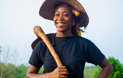 A young African lady working on a farm