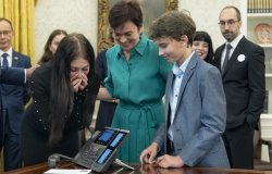 Evgenia Kara-Murza and her children talk to journalist Vladimir Kara-Murza on the phone following the prisoner swap with Russia 