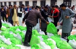 Polling staff are pictured picking up election materials.